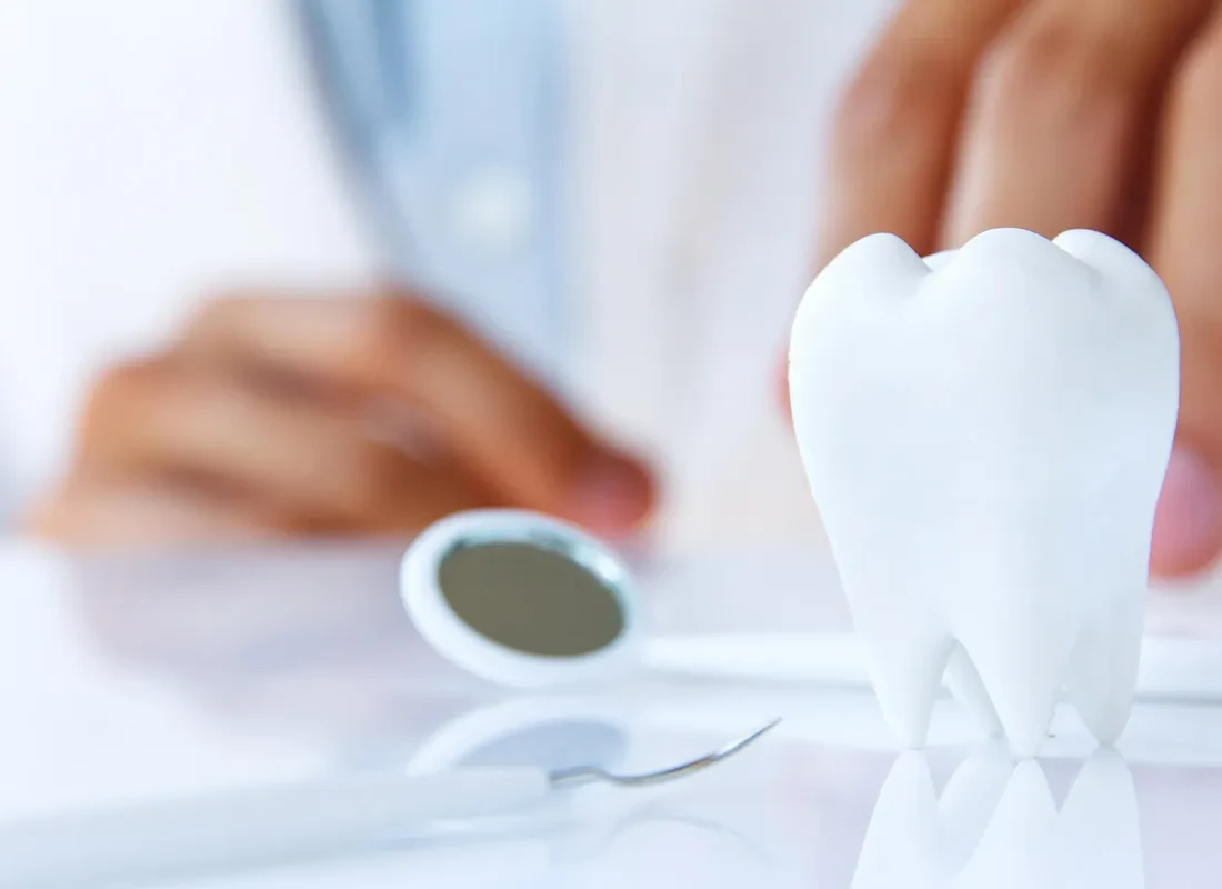 A patient reviewing dental insurance options at the front desk