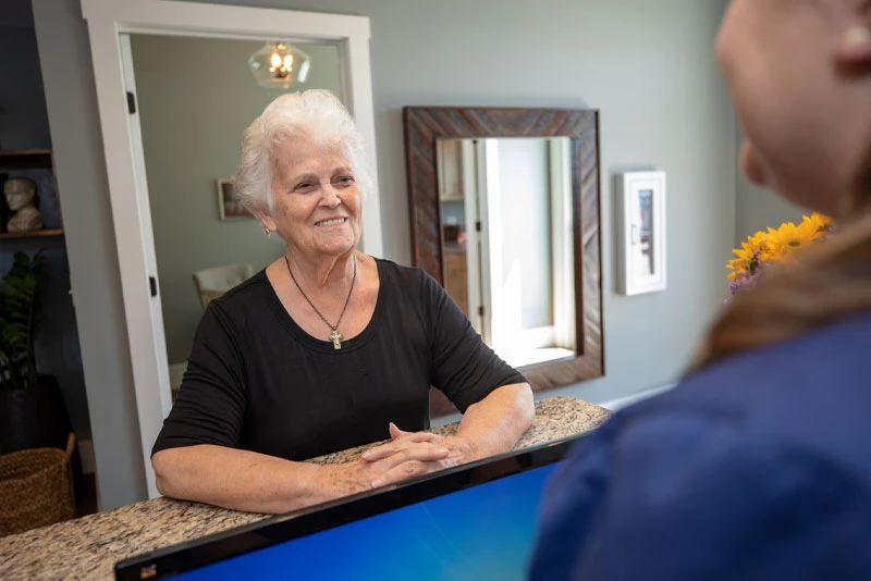 A patient discussing payment options with our front desk team